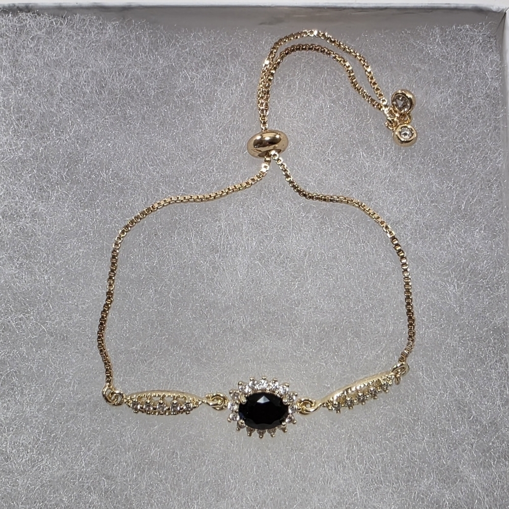 Elegant Gold Bolo Bracelet with Black Stone